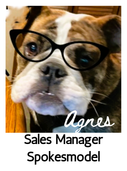Agnes the English bulldog wearing cat-eye glasses, with the title Sales Manager and Spokesmodel